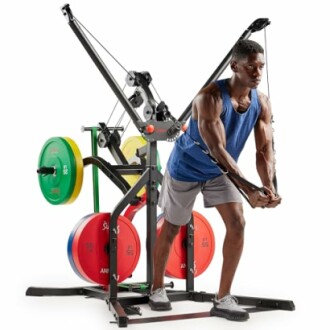 Man exercising with cable machine and weight plates