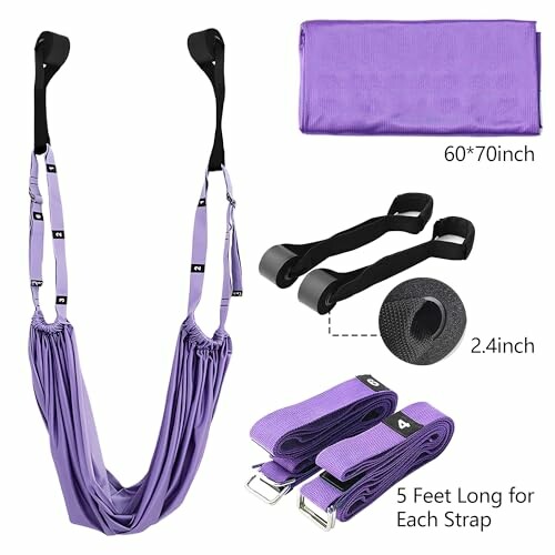 Purple yoga hammock set with accessories including straps and a folded fabric piece.