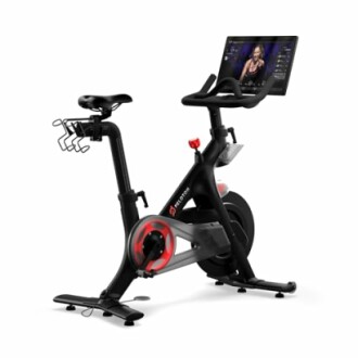 Stationary bike with attached screen and water bottle holder.