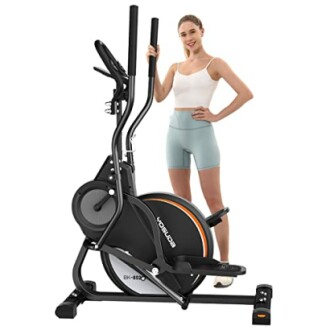 Woman standing next to a black exercise bike.